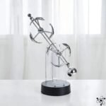balancier de newton anneaux elegant et harmonieux dauphins double 735 1