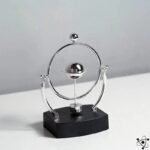 Balancier de Newton où Gravité et Physique Rencontrent Harmonieusement