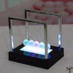 pendule de newton lumineux eblouissant pour decoration 776 1