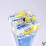 sablier stellaire avec liquide transparent et figurines 258 1
